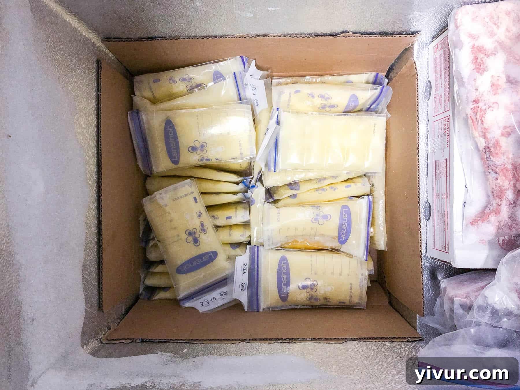 A child happily drinking from a sippy cup, illustrating the use of pumped milk for older children.