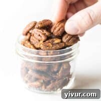 Paleo Candied Pecans in a bowl, a healthy and delicious snack.