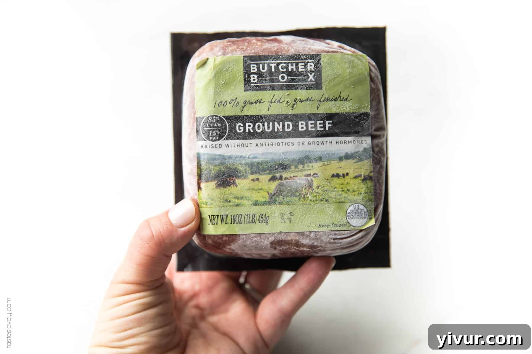 A variety of fresh, high-quality meat cuts from ButcherBox displayed on a wooden cutting board