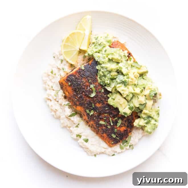 Whole30 and Keto blackened salmon over cauliflower risotto with chunky avocado topping