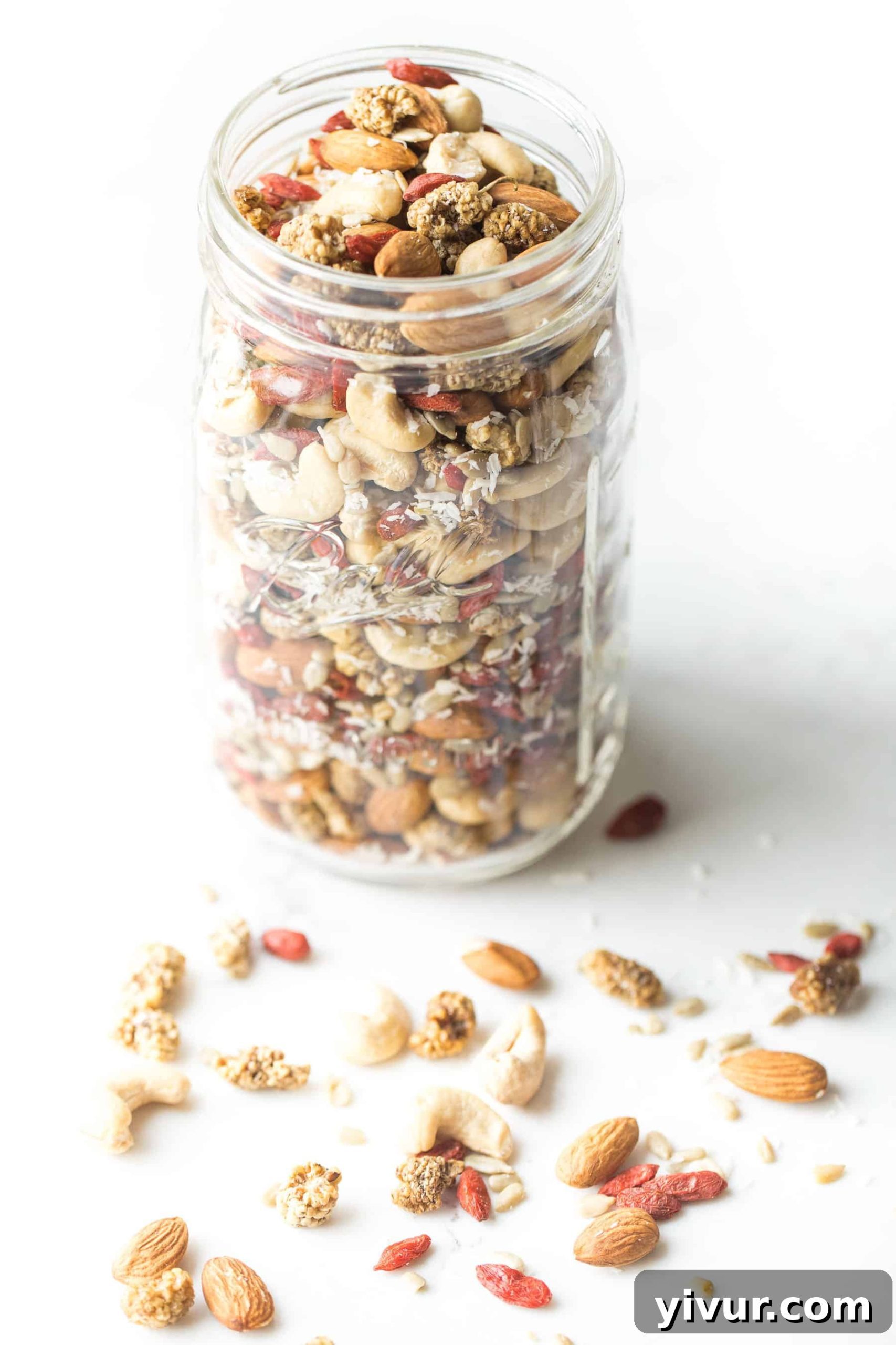 The Paleo and Whole30 Superfood Snack Mix neatly packed in a mason jar, ready for travel or storage.