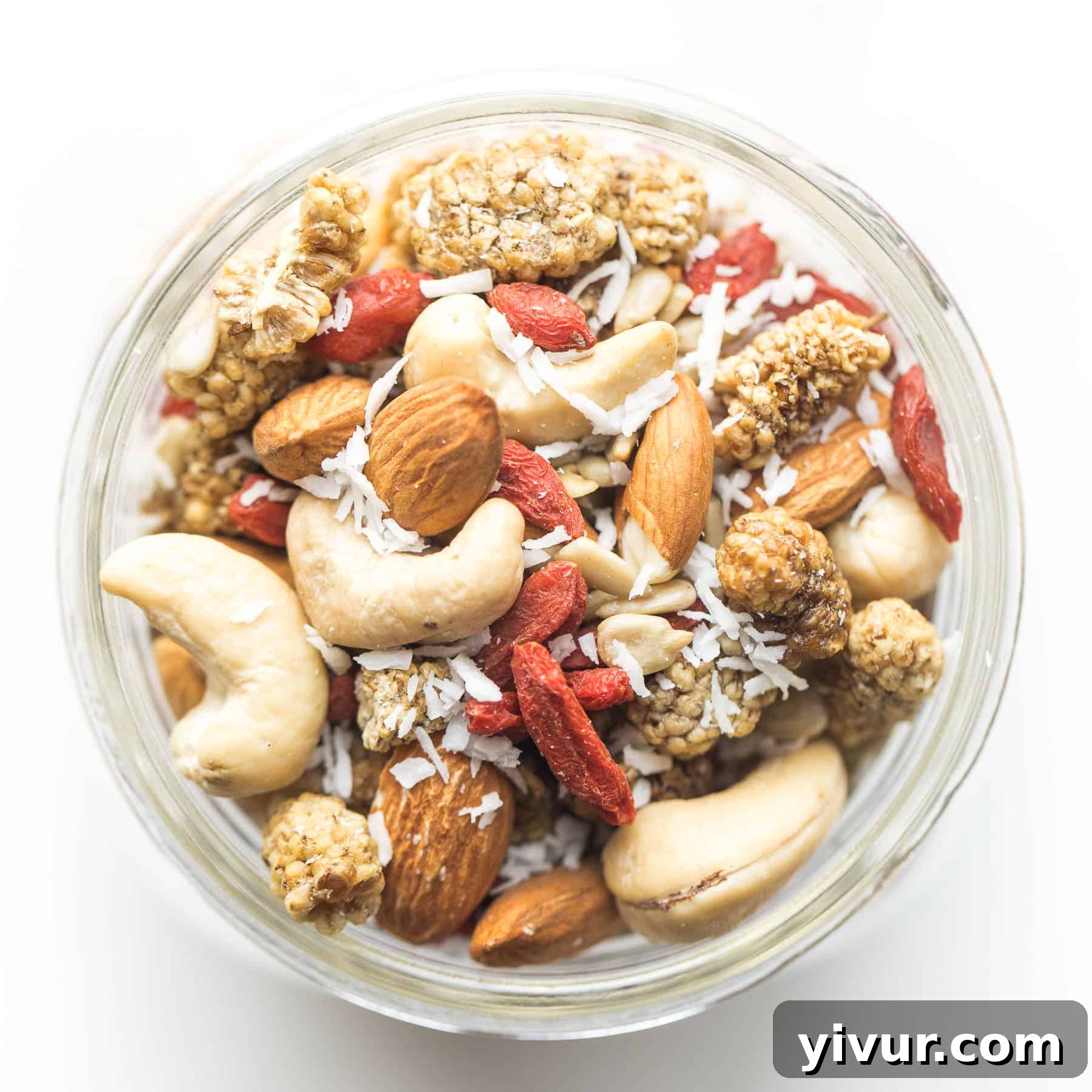 A close-up of the superfood snack mix in a mason jar, showcasing the rich textures and colors of the ingredients.
