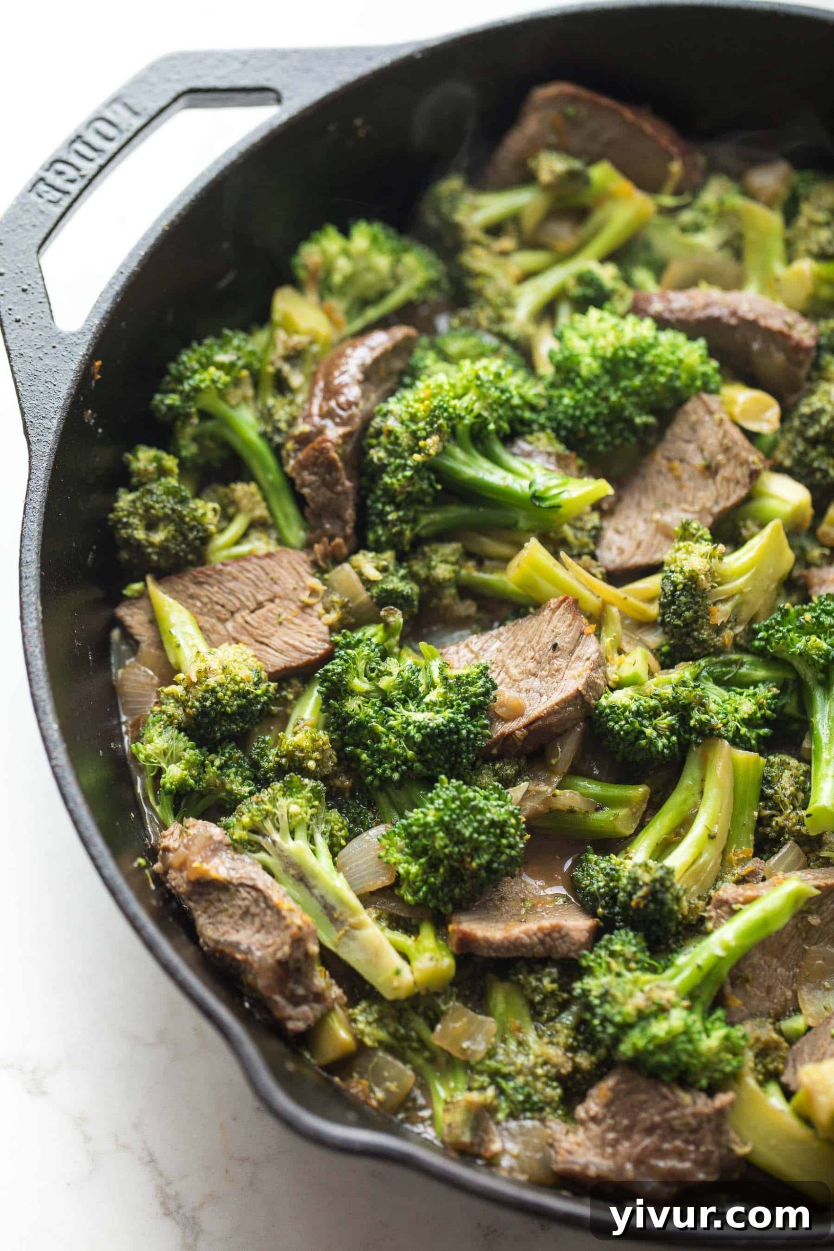broccoli beef in a cast iron skillet
