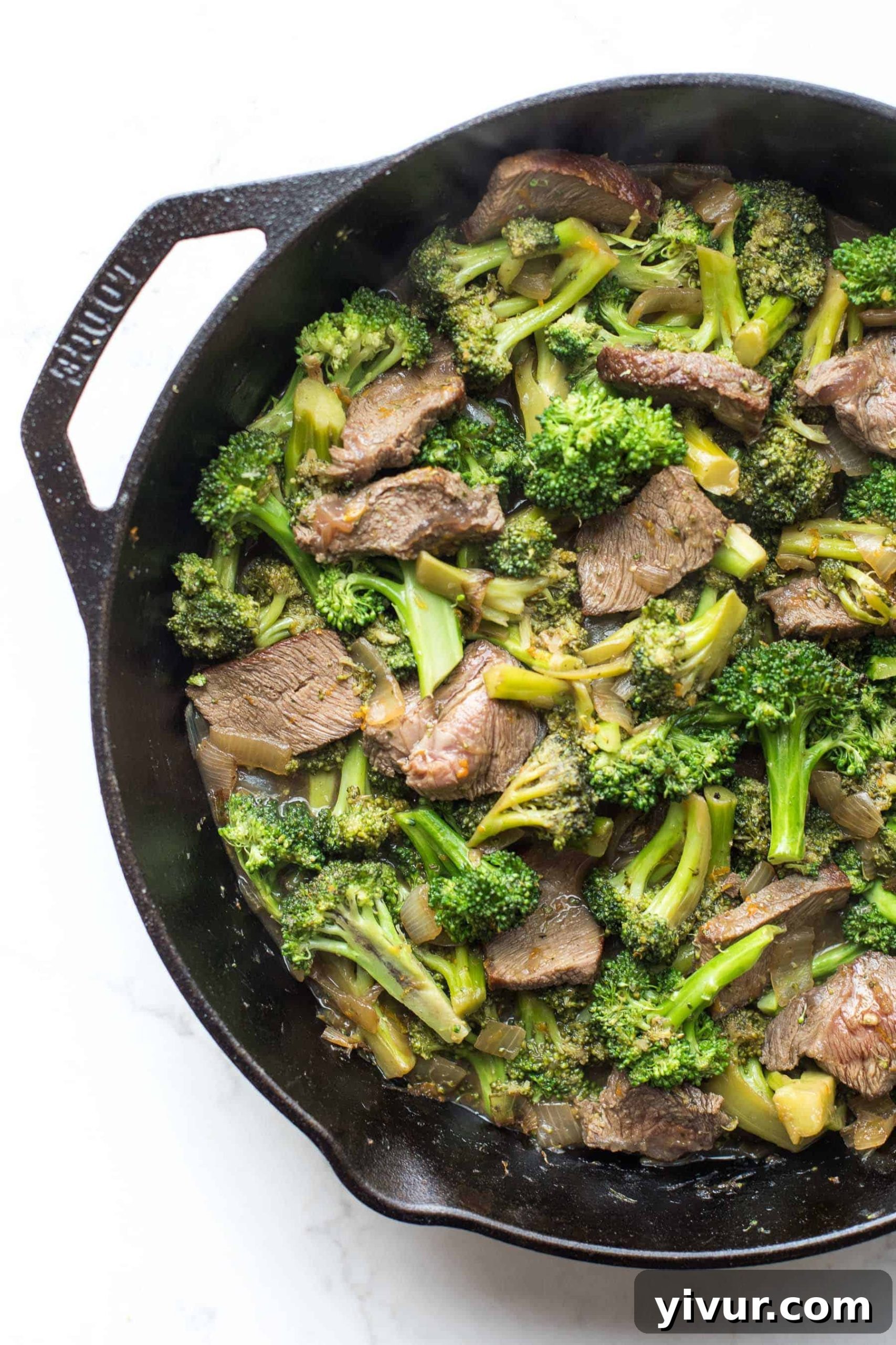 broccoli beef in a cast iron skillet
