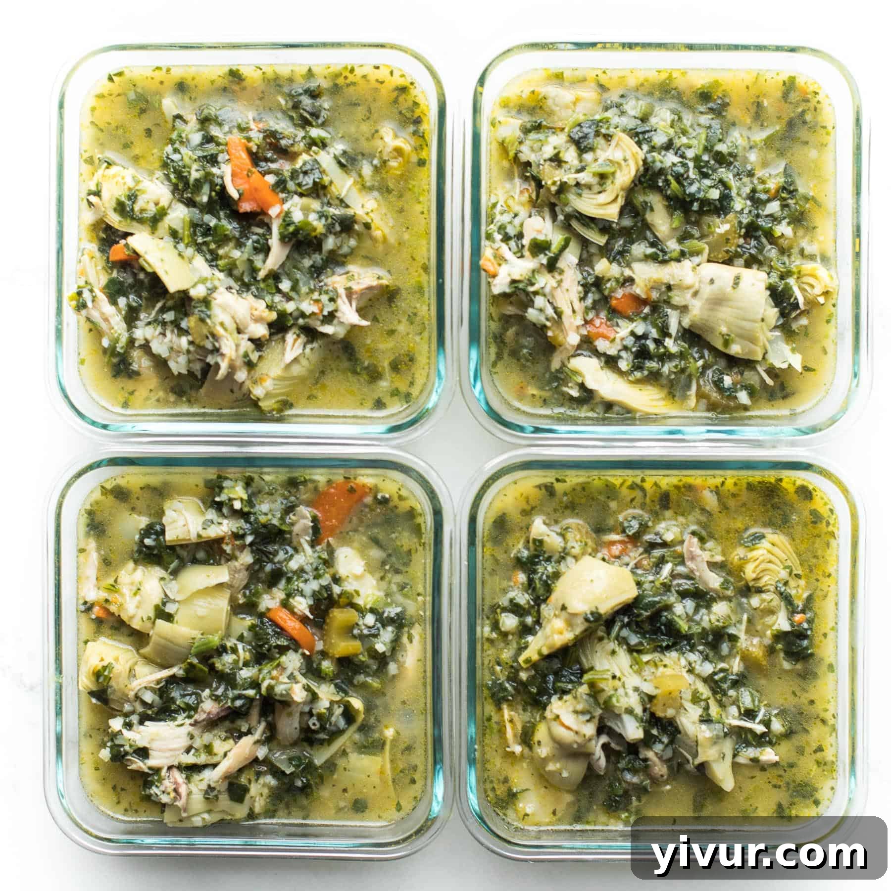 Zesty Lemon Artichoke Chicken Soup Whole30 Keto 6 Several servings of Lemon Artichoke Chicken Soup neatly packed into meal prep containers, ready for healthy and convenient future meals.
