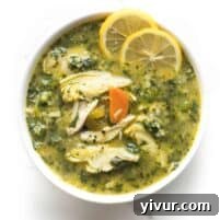 Zesty Lemon Artichoke Chicken Soup Whole30 Keto 7 Close-up of a rustic bowl filled with Whole30 + Keto Lemon Artichoke Chicken Soup, garnished with fresh herbs, ready to be enjoyed.