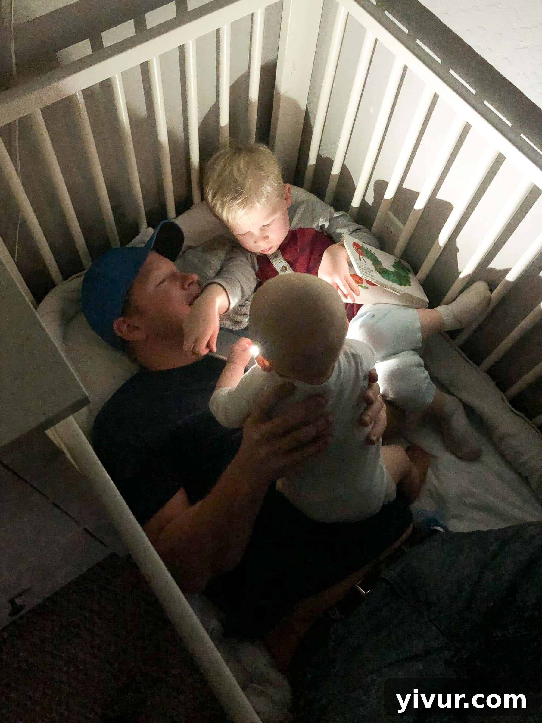 A masterclass in multitasking: Mom diligently breaking down chickens for meal prep, highlighting her commitment to healthy family meals, while baby Ryan happily enjoys snacks in his high chair nearby.