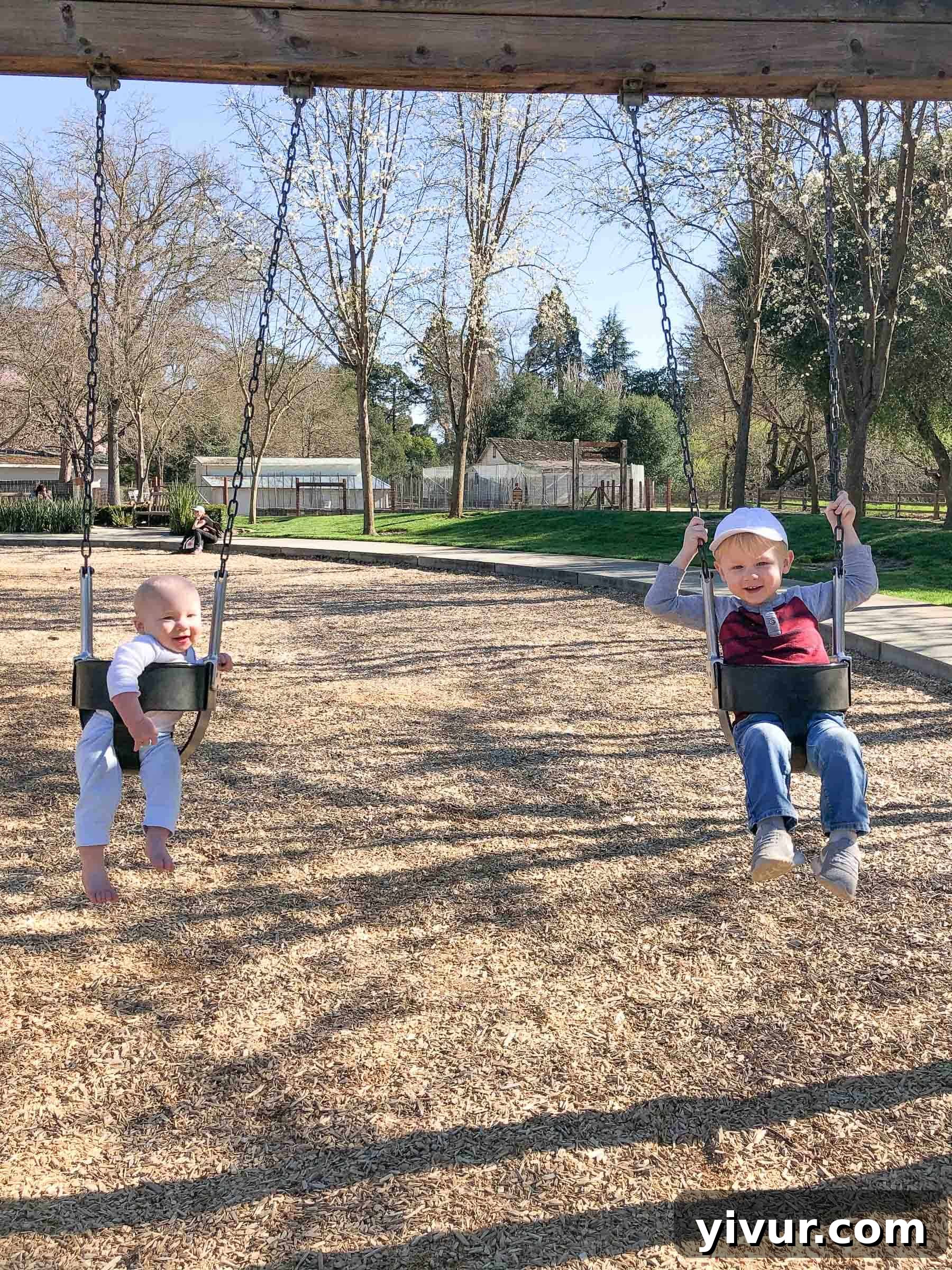 A tender father-son moment: Shawn lovingly reads a story to baby Ryan, who is nestled in Josh's bed, showcasing the strong family connection and the importance of shared storytelling.