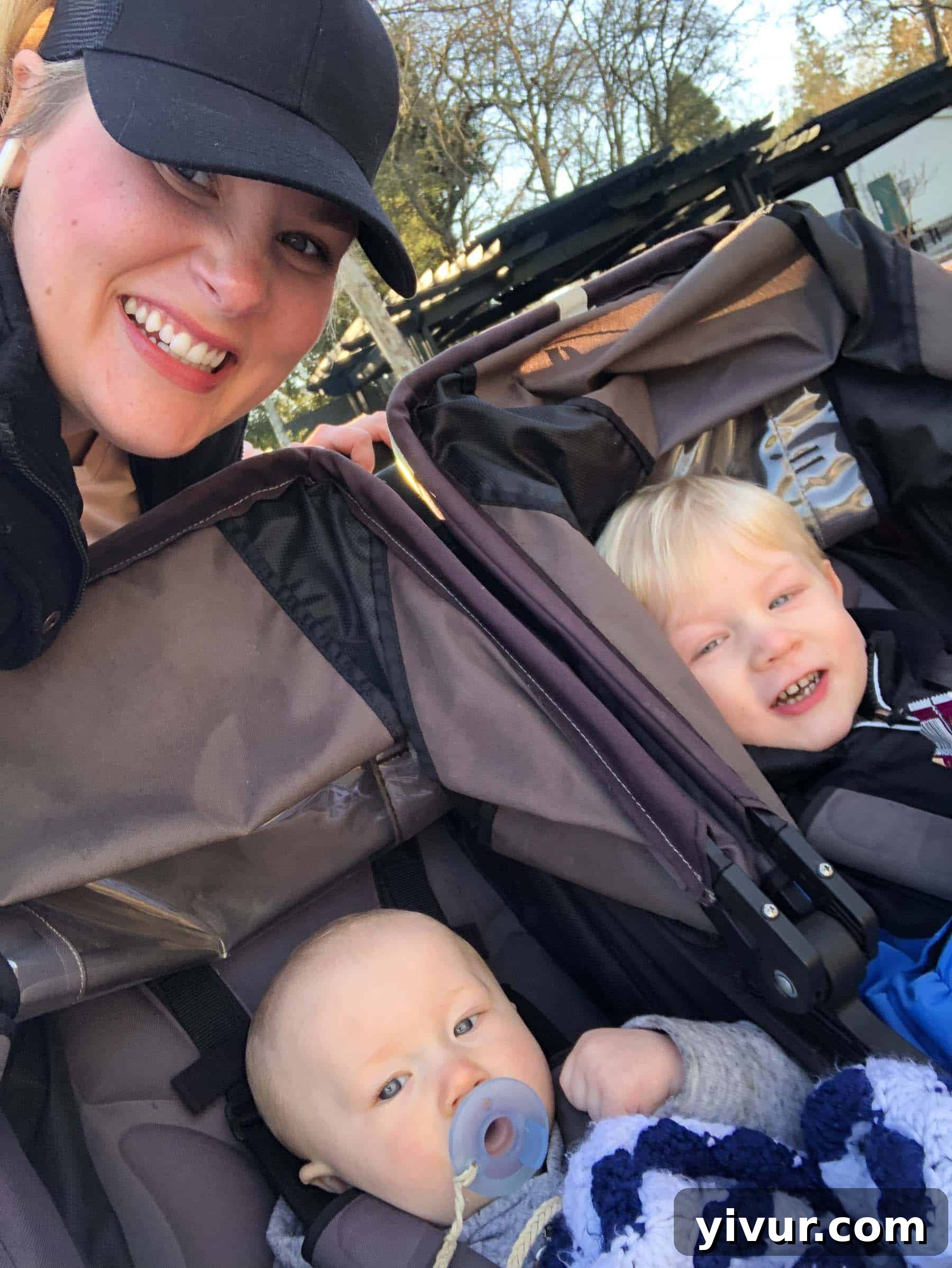 A heartwarming scene of family time outdoors: Mom walking hand-in-hand with Josh, his younger brother Ryan in a stroller, on their way to preschool. This image celebrates daily rituals and fresh air.
