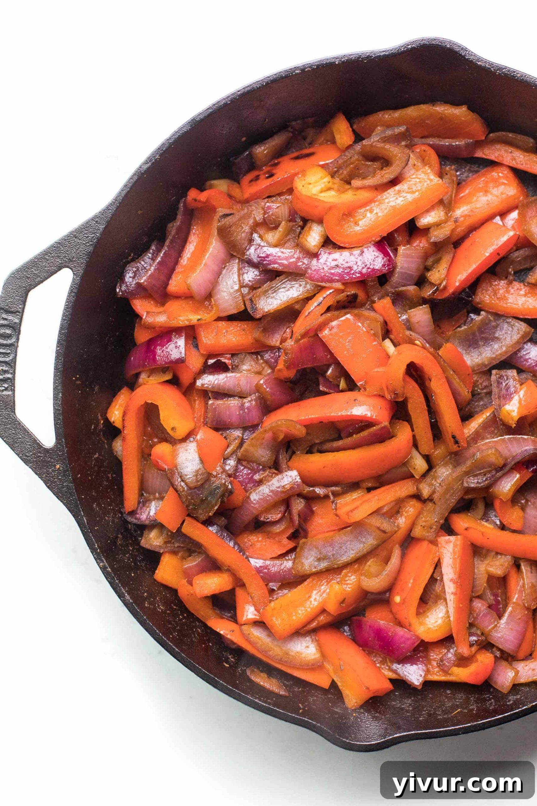 Wholesome Fajita Veggies Whole30 Paleo Keto 4 Cooked Whole30 fajita veggies, perfectly caramelized and vibrant, showcased in a cast iron skillet, emphasizing their readiness for a healthy Mexican meal.