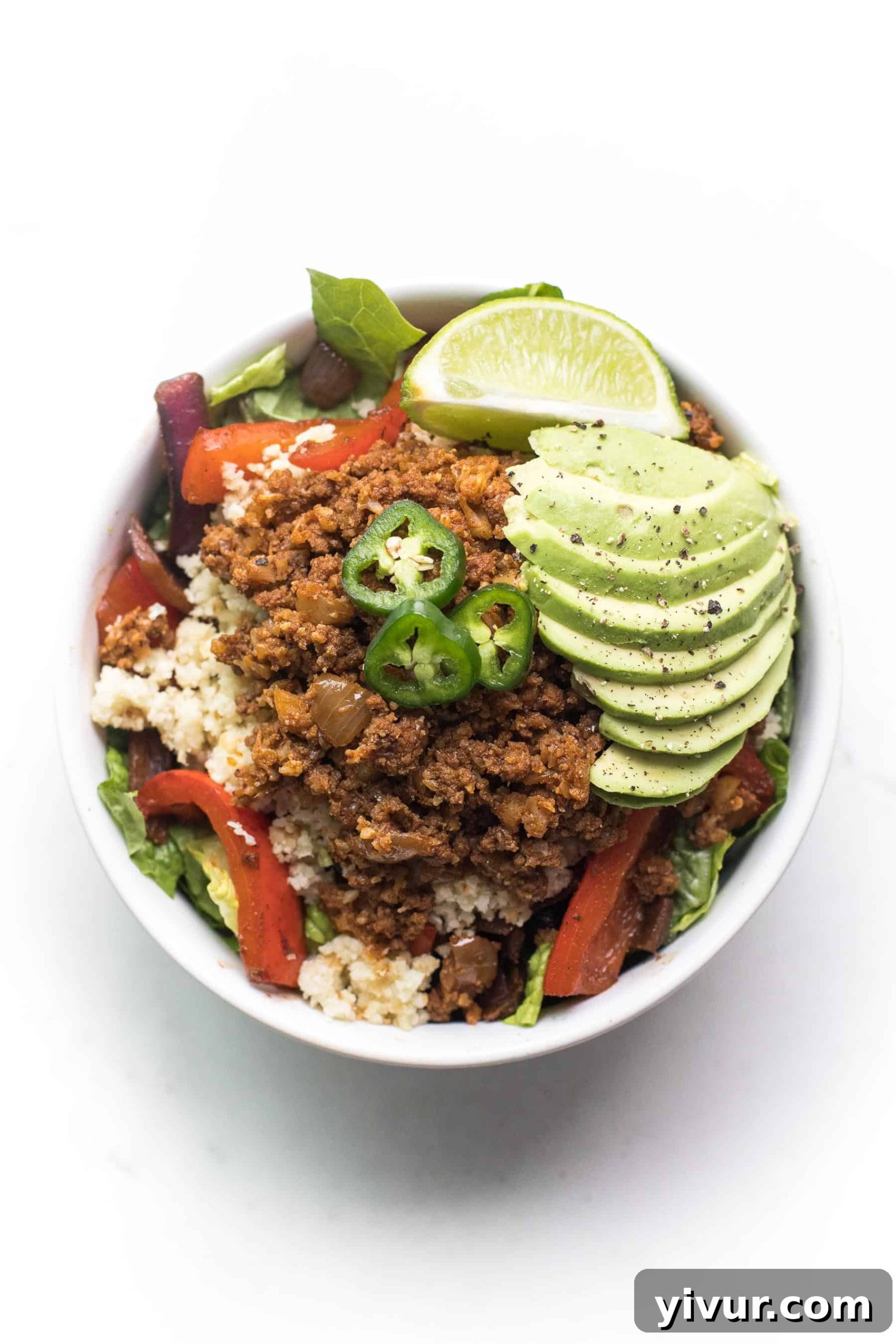 an overhead shot of a a beef burrito bowl recipe in a white bowl