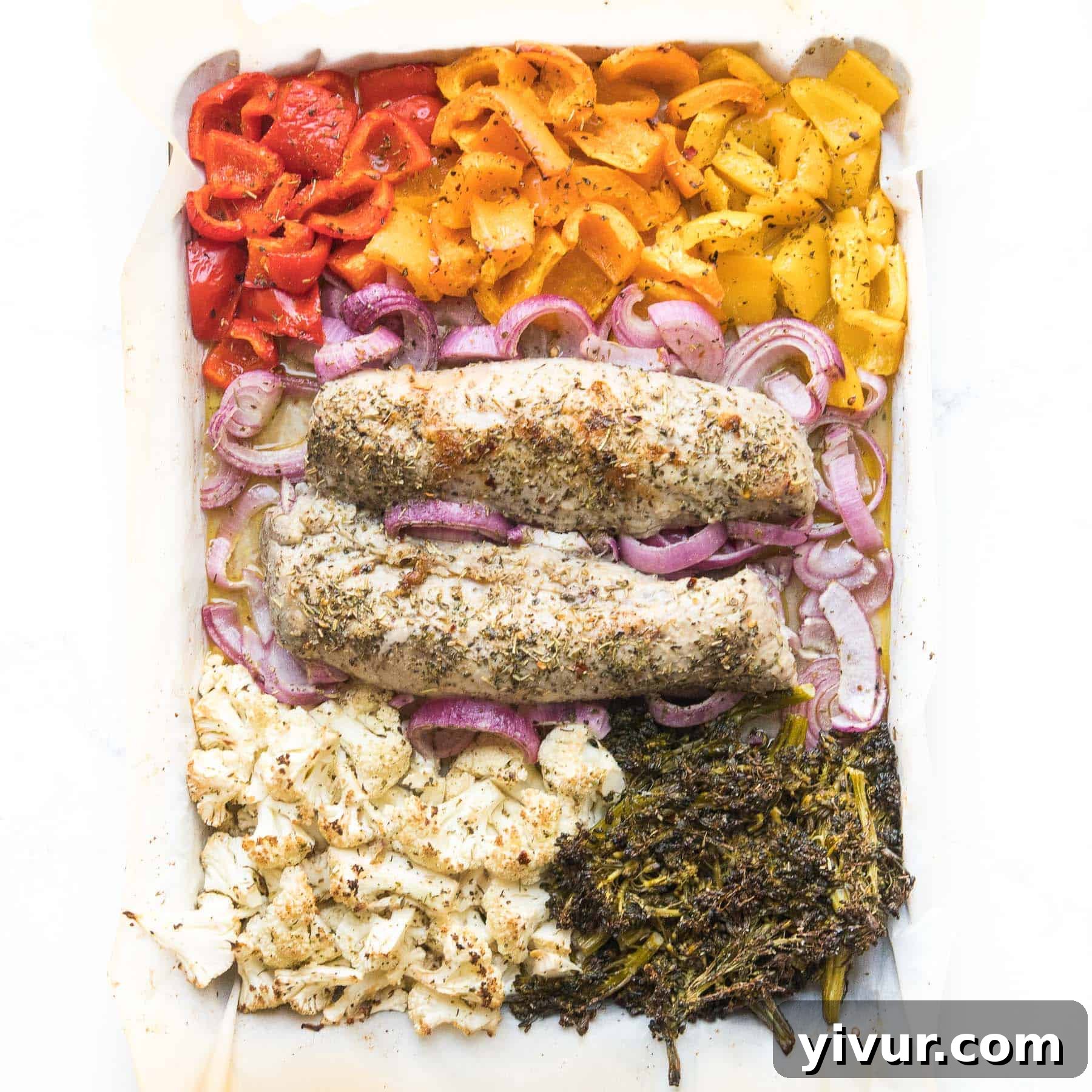 Delicious Whole30 Keto Sheet Pan Italian Pork Tenderloin with vibrant roasted vegetables and fresh herbs