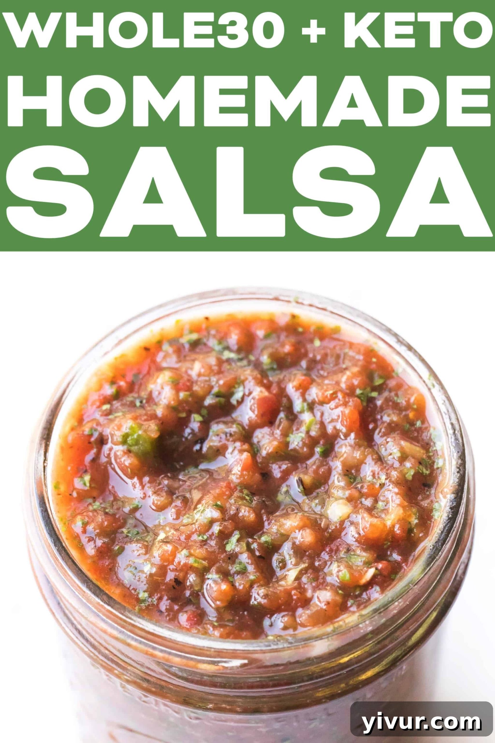 A top-down shot of a small white bowl filled with homemade red salsa, garnished with fresh cilantro, invitingly placed on a white surface.