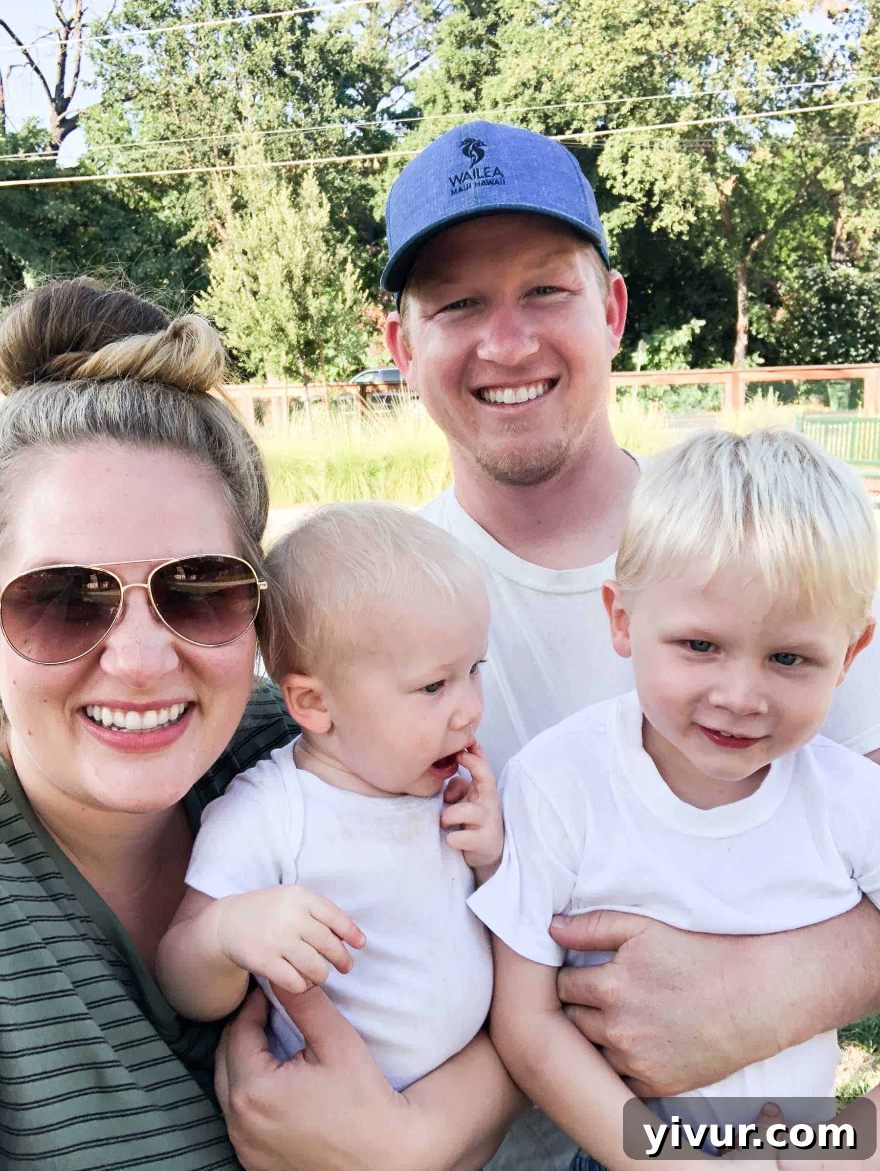 A Glimpse into Summer 2019 13 A family enjoying an afternoon walk, with one parent pushing a stroller and the other walking with a child.