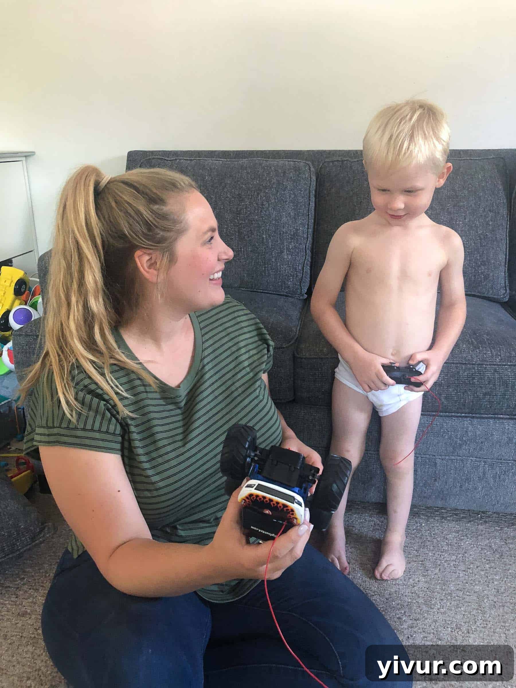 A Glimpse into Summer 2019 6 A toddler, Ryan, sitting in a kitchen sink for a quick bath, looking happy and clean.