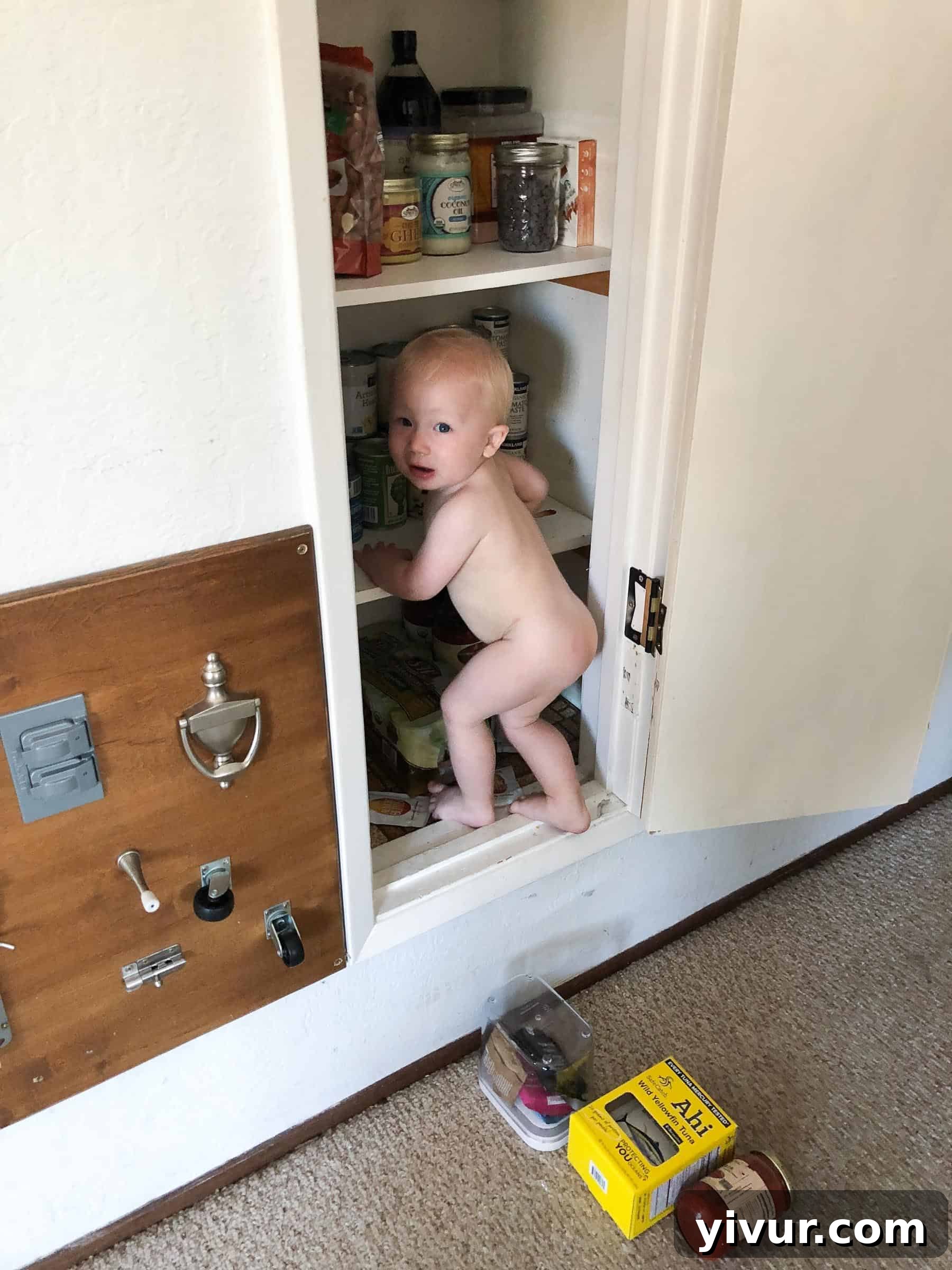 A Glimpse into Summer 2019 8 Two young children playing in a sandbox at a park, surrounded by other kids and adults.