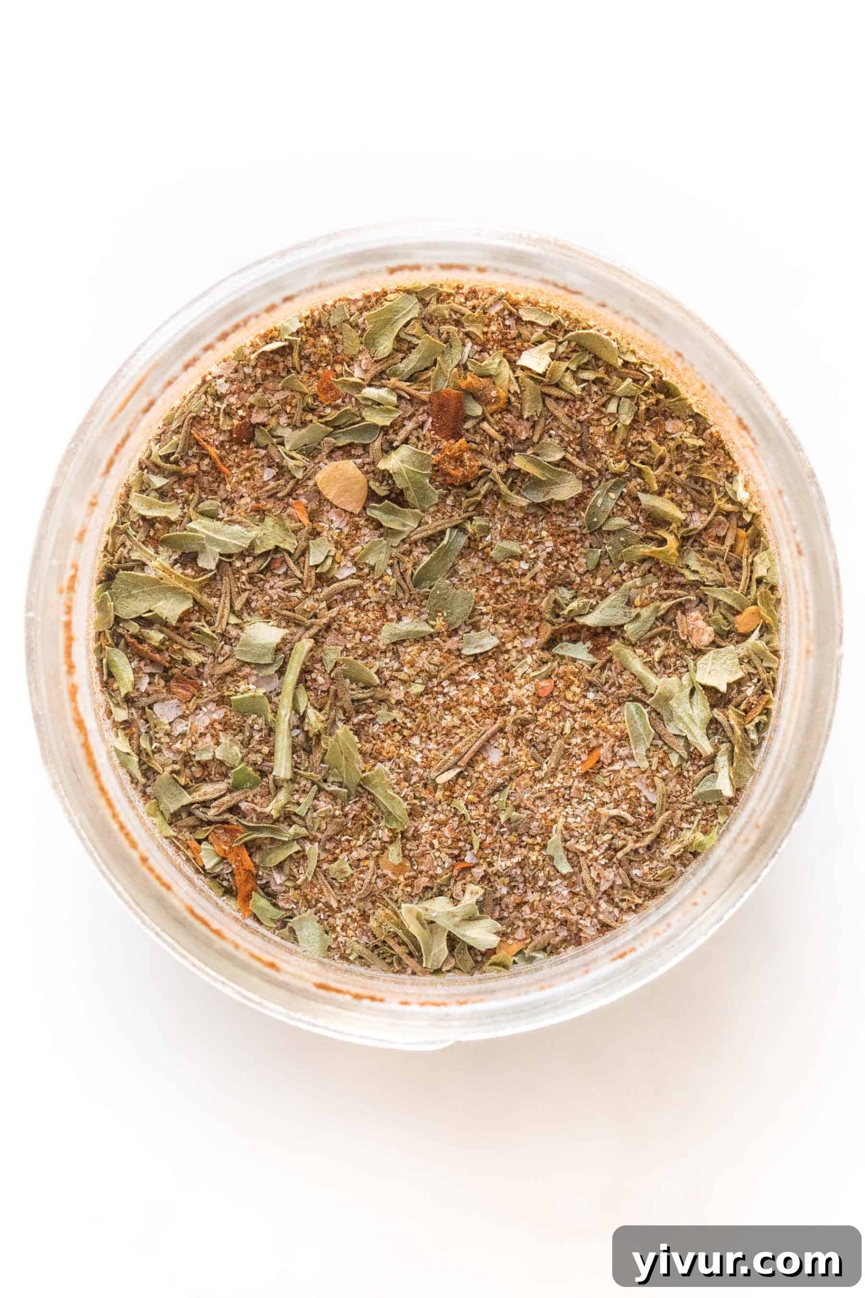 jamaican jerk seasoning in a mason jar on a white background