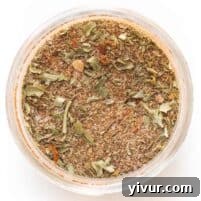 jamaican jerk seasoning in a mason jar on a white background