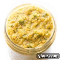 Close-up of fresh mango salsa in a small bowl, garnished with cilantro.
