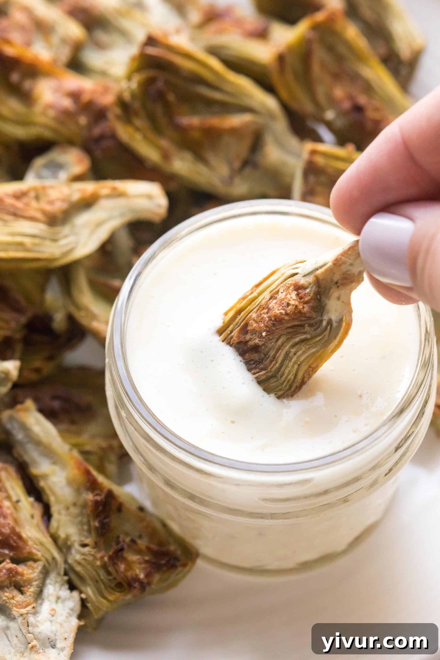 Frozen artichoke hearts roasted and dipped in lemon garlic aioli