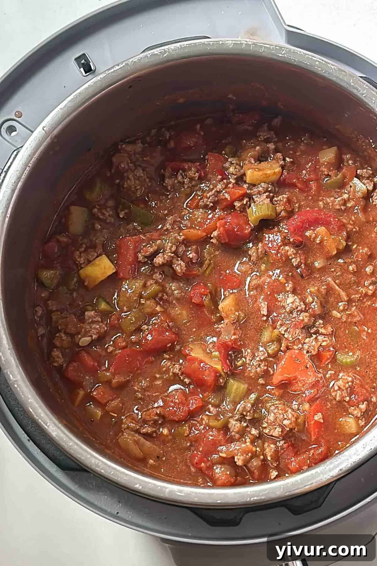 Keto Whole30 Instant Pot Chili Beanless and Easy 7 An Instant Pot filled to the brim with a rich, hearty Whole30 keto chili mixture, with the lid secured and ready for pressure cooking.