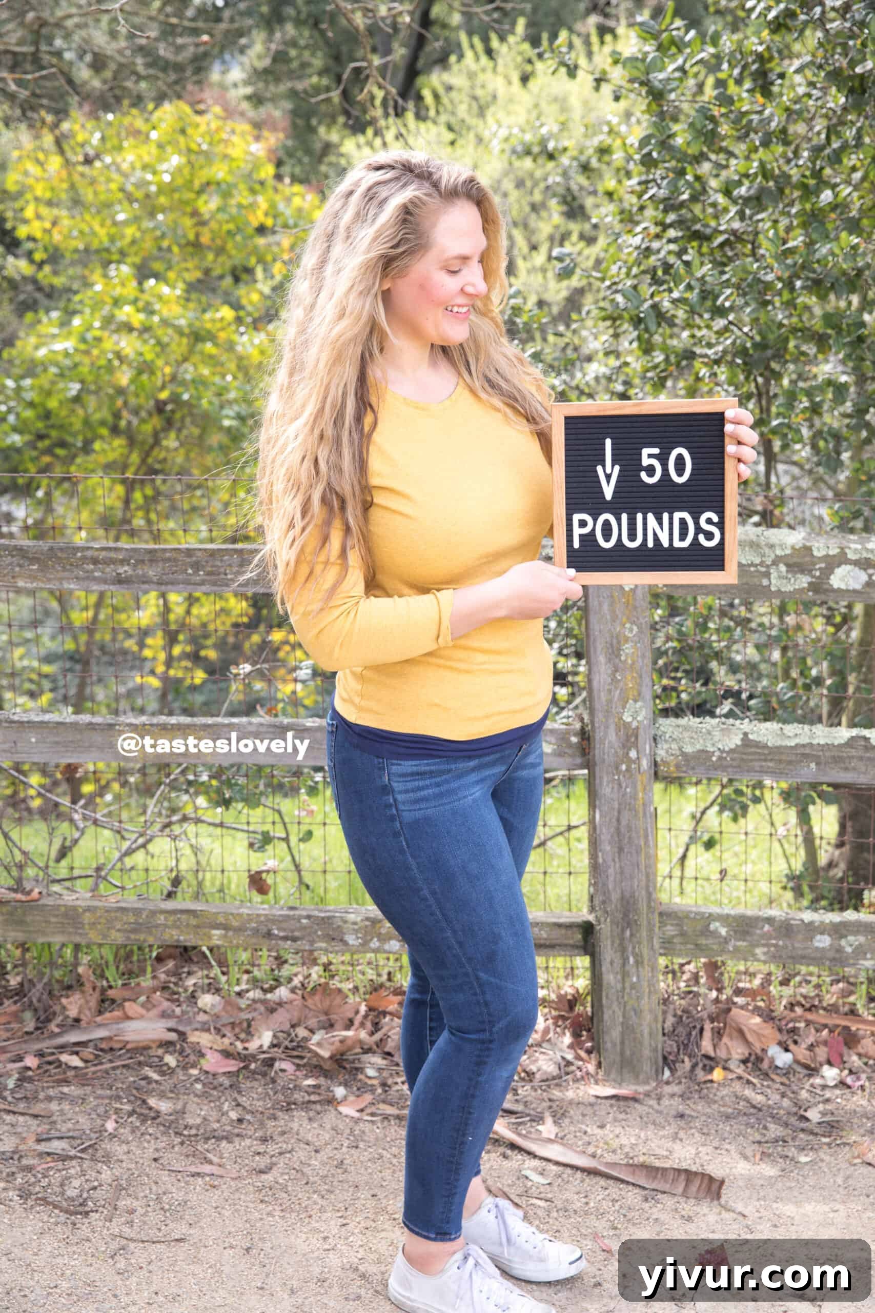 Unlocking a New Me: My 50-Pound Keto Success in Half a Year 2 Woman holding a sign 'Down 50 Pounds Weight Loss' showcasing her clean keto transformation.