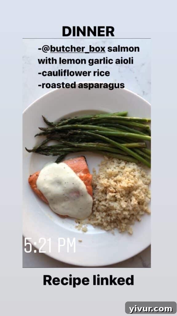 Pan-seared Salmon with Lemon Garlic Aioli, served with roasted asparagus and cauliflower rice for a light and healthy Whole30 and keto dinner.
