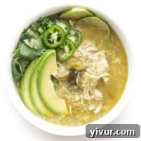 Effortless Whole30 Keto Instant Pot Verde Chicken Chili 6 verde chicken chili in a white bowl on a white background