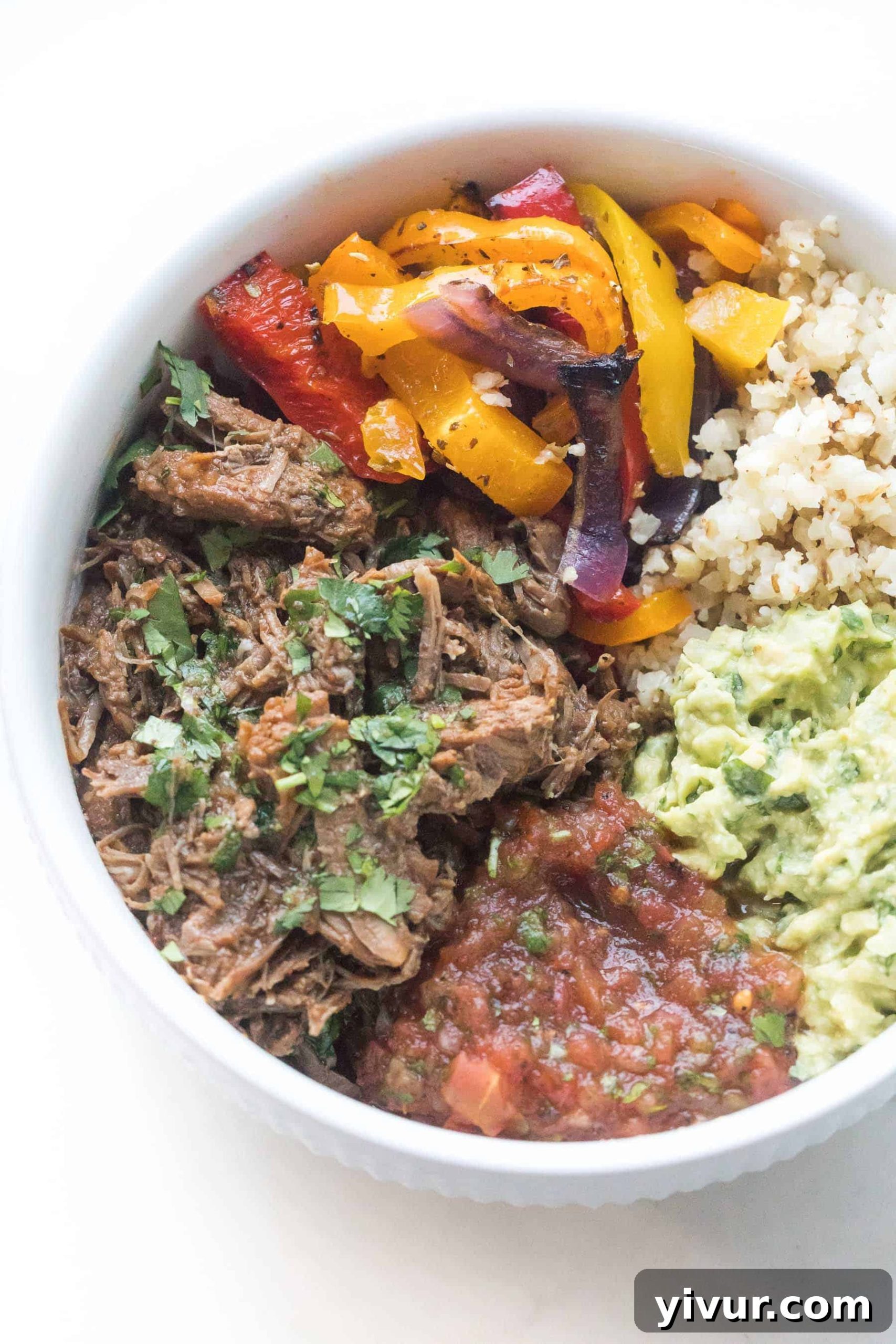 Barbacoa burrito bowl with various toppings