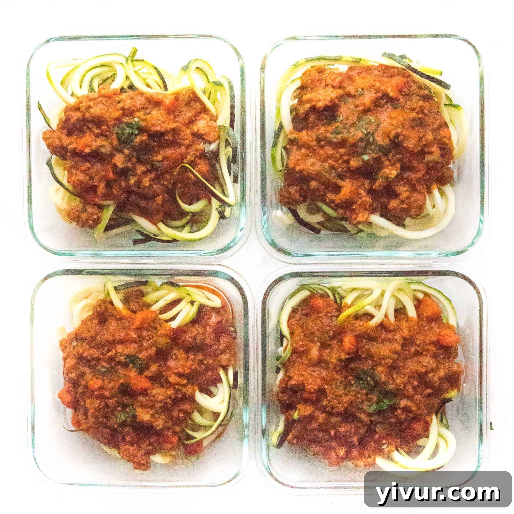 zucchini noodles with bolognese sauce in meal prep containers