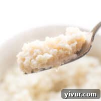 fork holding cauliflower rice risotto