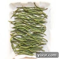 Roasted green beans in a bowl, ready to be served as a side dish
